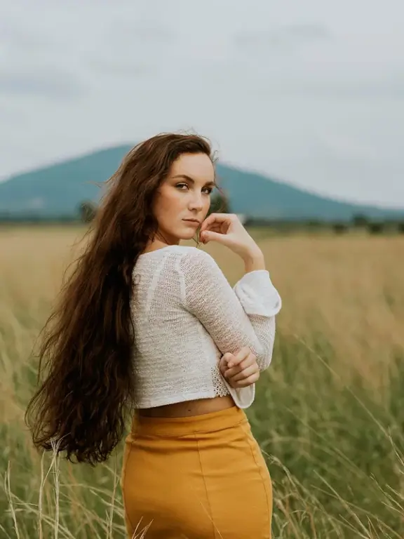 woman standing on grass field